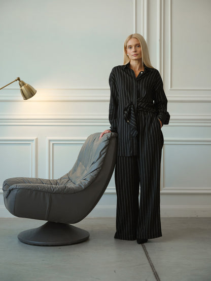 A striped linen suit in black with palazzo pants