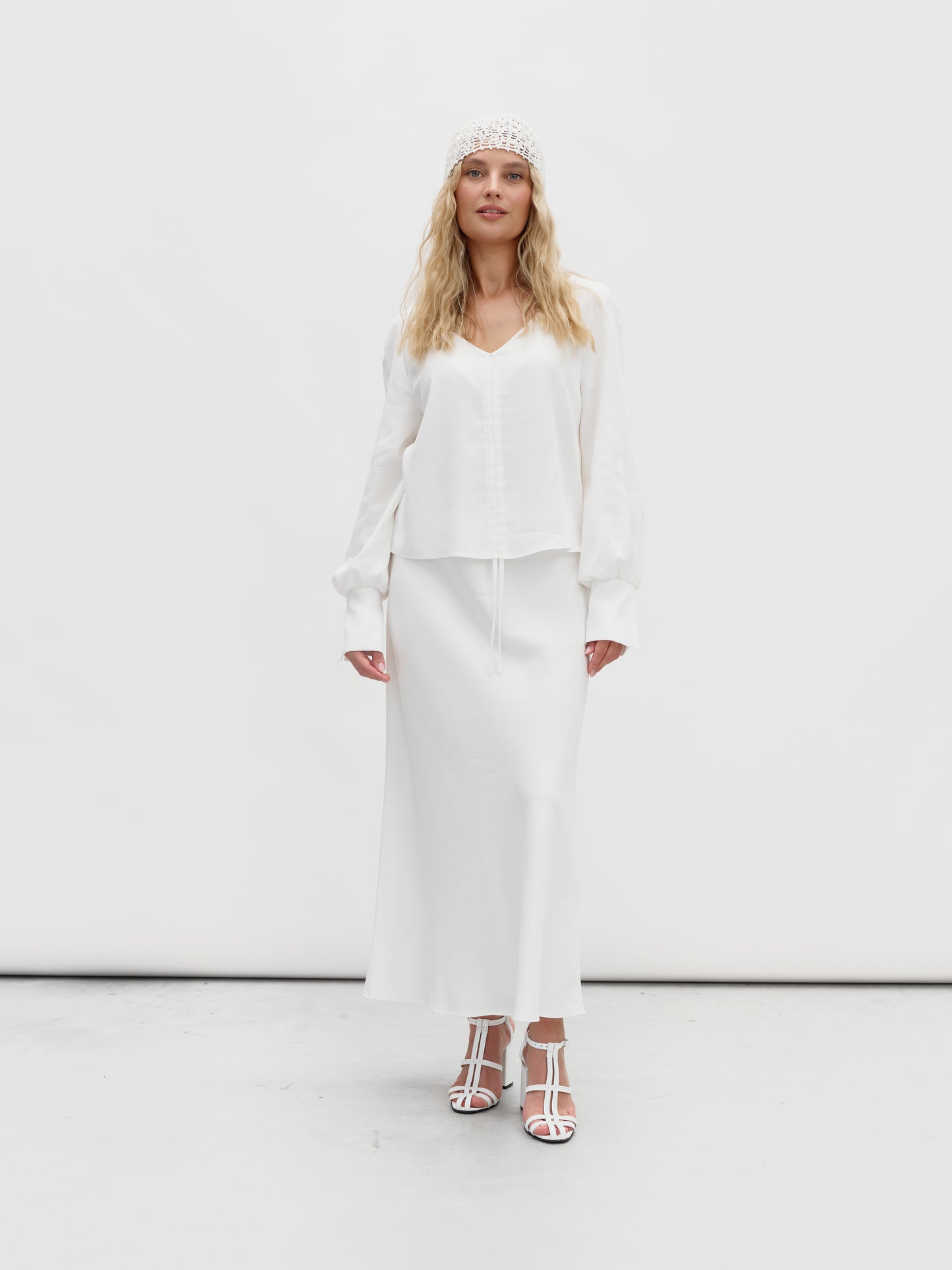 A white eucalyptus suit with a skirt