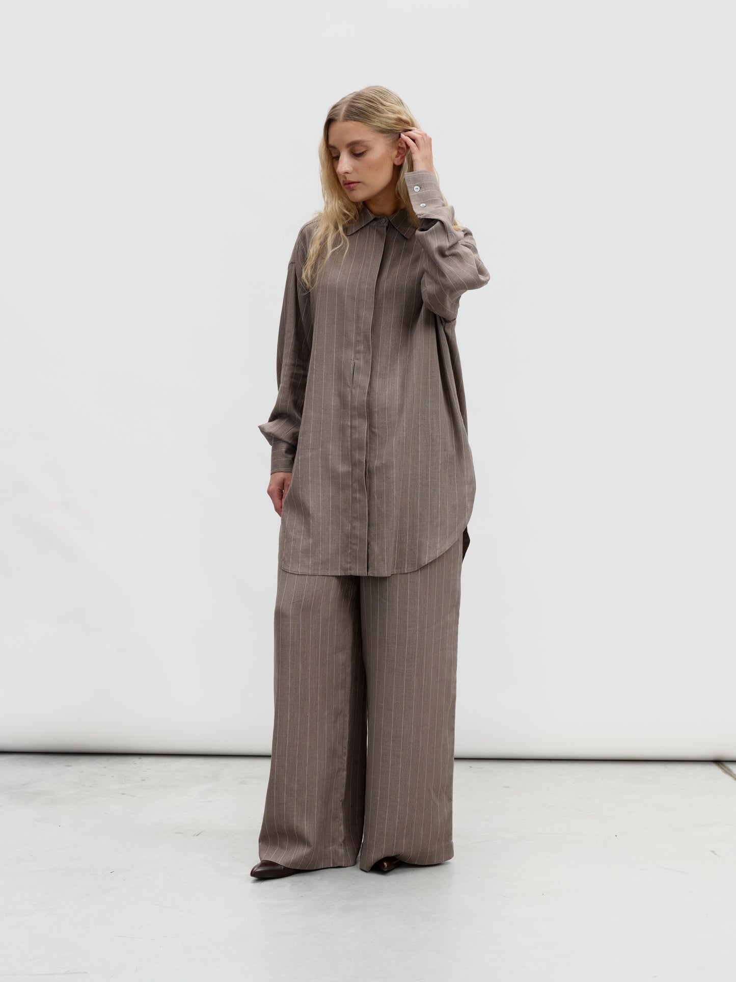 A linen striped suit with palazzo pants in light brown color